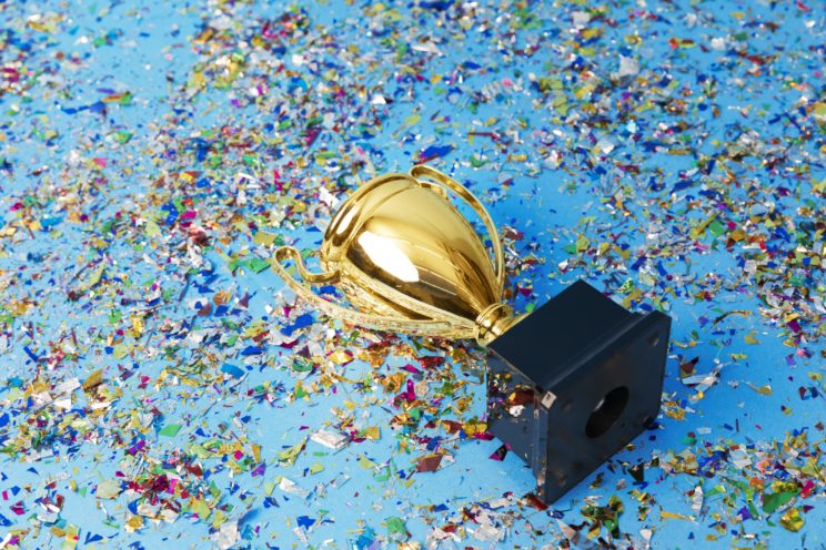 Trophy lay down with confetti covering floor