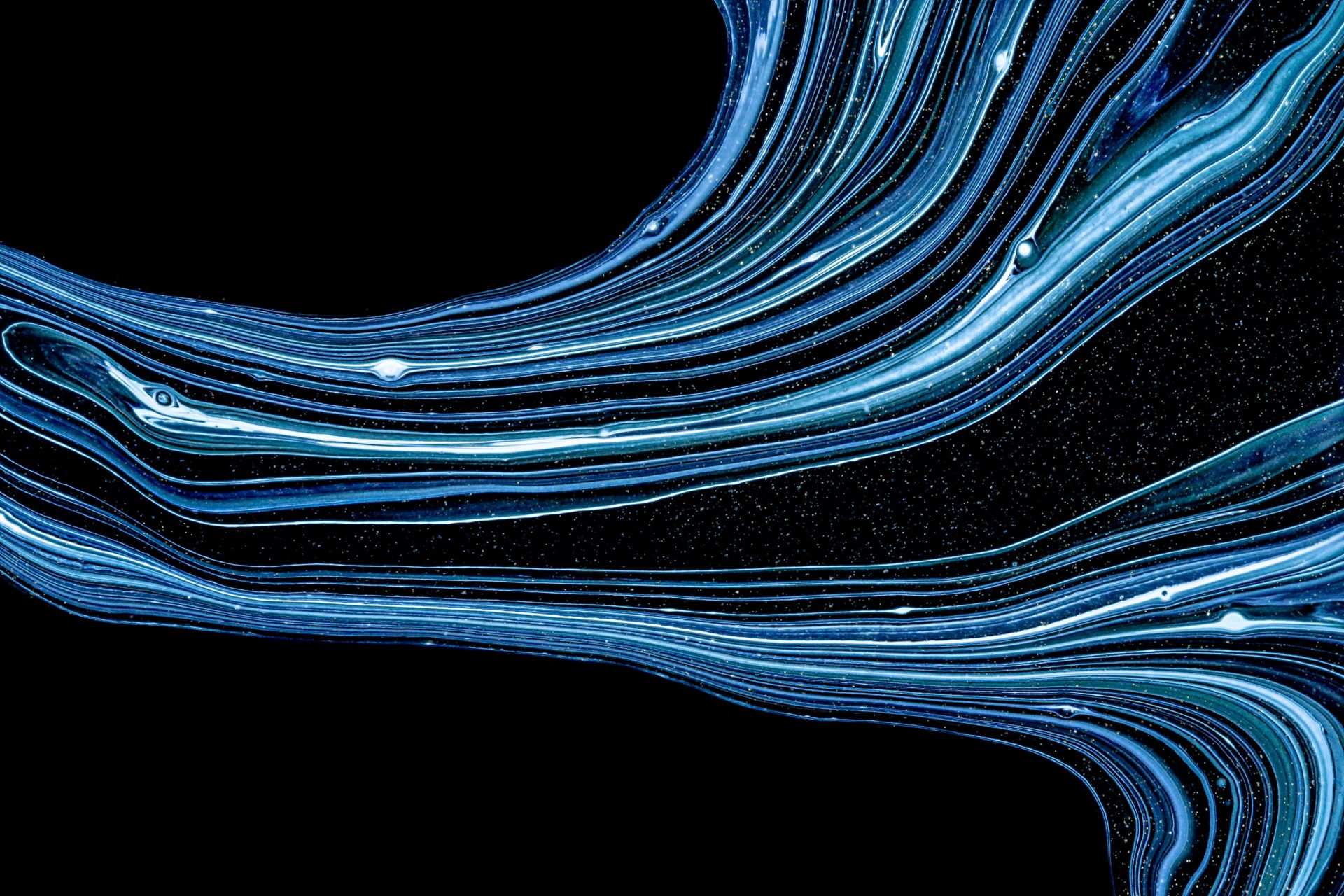 Blue swirling lines on a black background