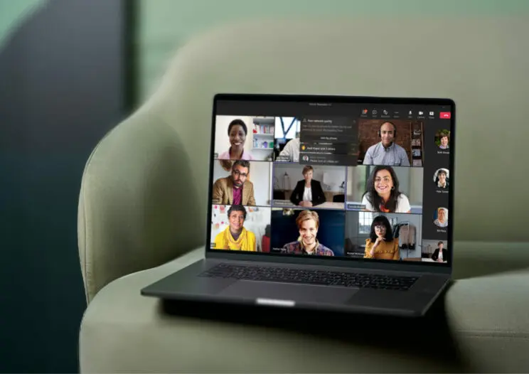 Laptop on green chair with a Microsoft Teams Meeting on the screen