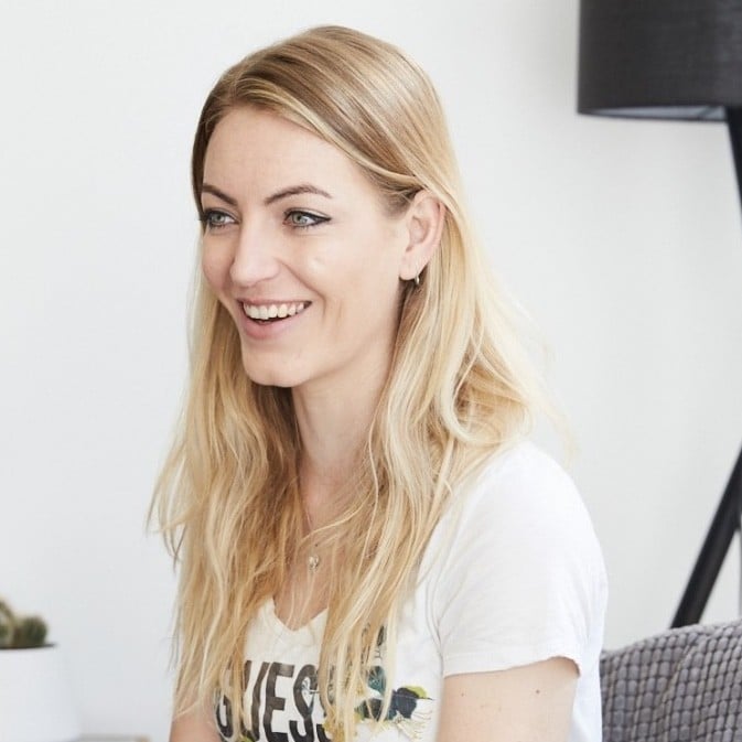 Young Professional Smiling During A Business Meeting