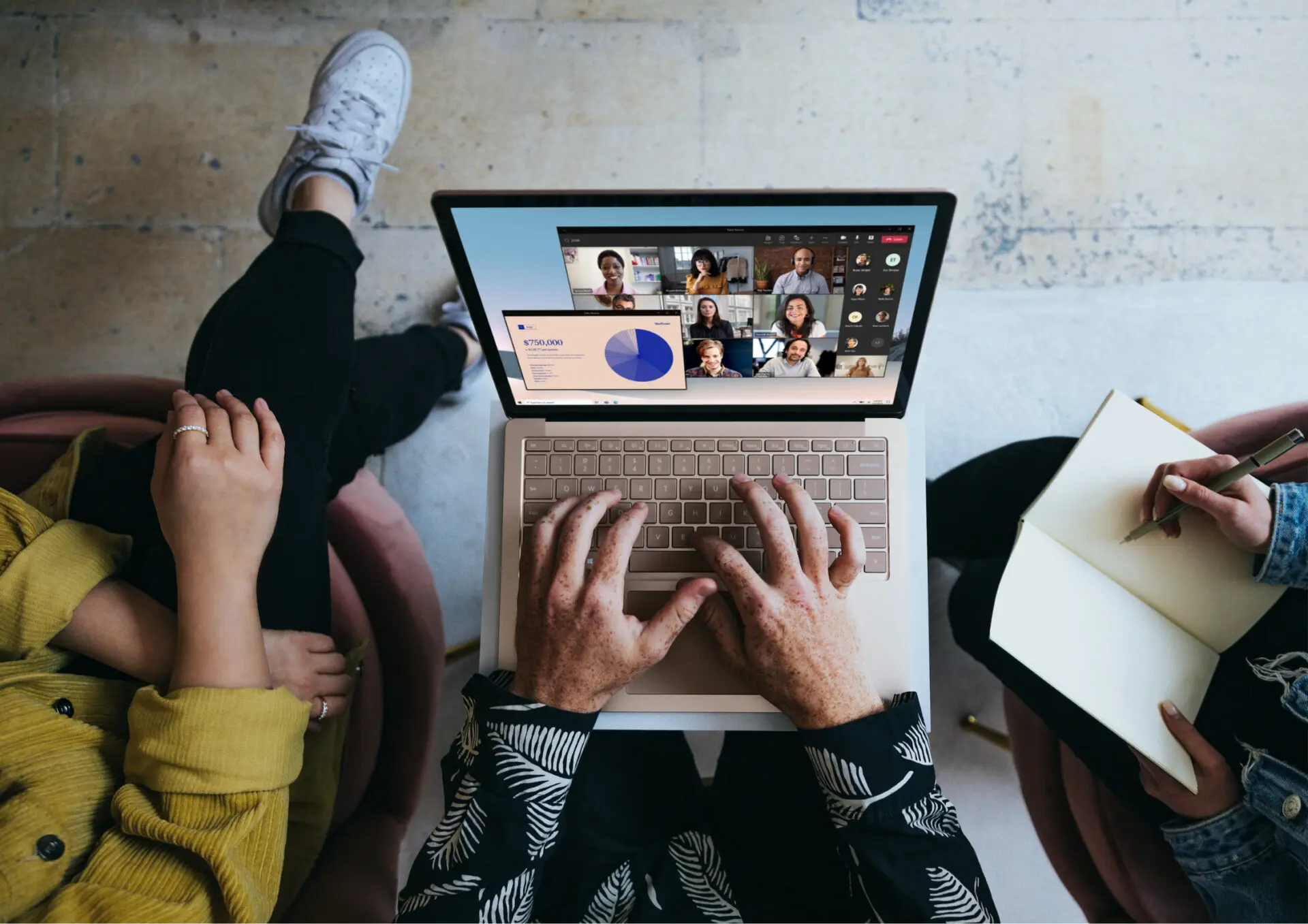 Laptop in the hands of a man near the other people on a Microsoft Teams Video Call