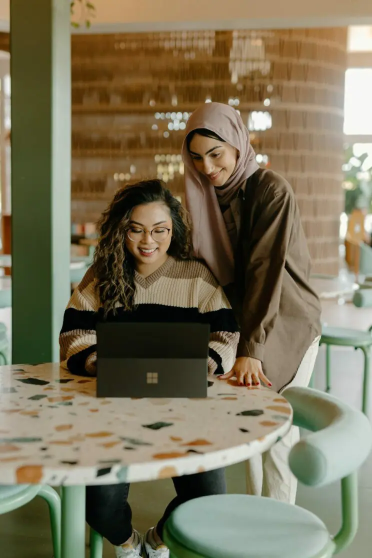 Two Female colleagues using Microsoft Surface Tablet